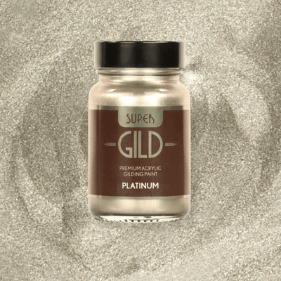 Bottle of Super Gild premium acrylic gilding paint on a glittery background