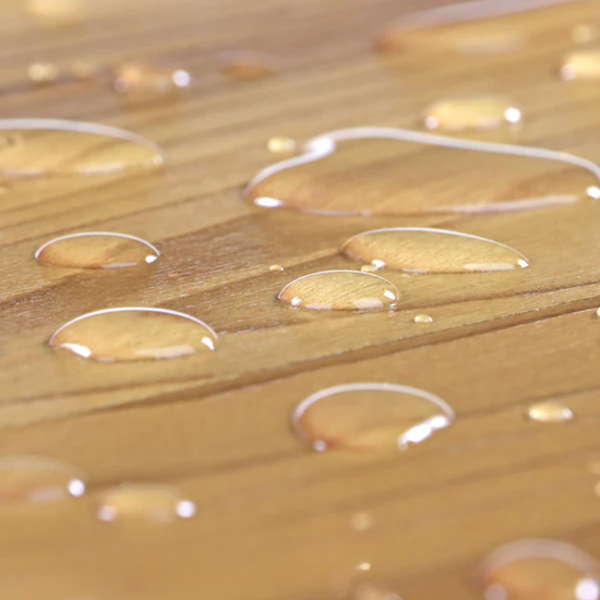 Close-up of water droplets on a wooden surface