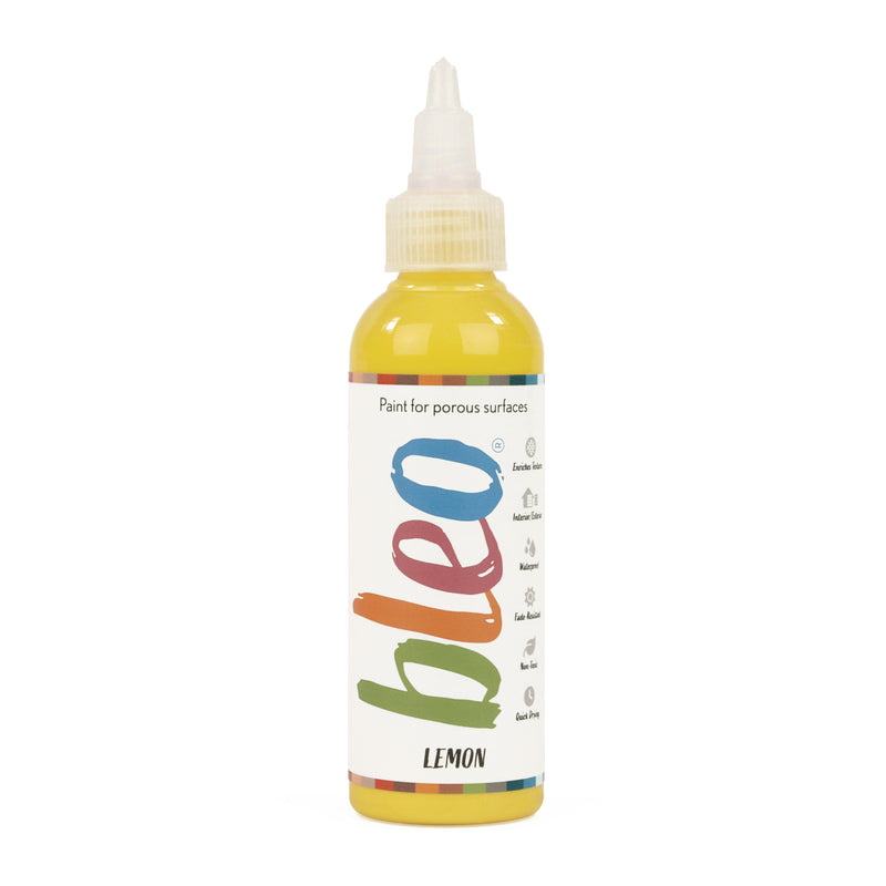 A bottle containing coloured gel paint, on a white background of bleo lemon