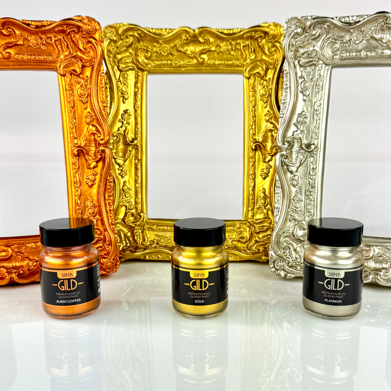 Three jars of Super GILD next to frames painted in Super GILD