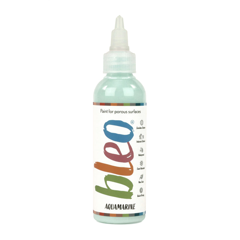 A bottle containing coloured gel paint, on a white background of bleo aquamarine