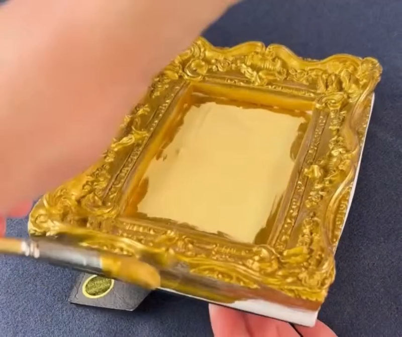 A resin picture frame fully covered in Super GILD Gold