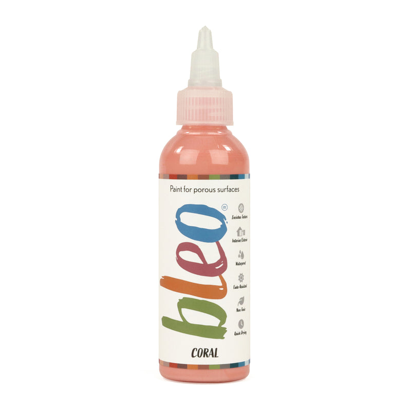 A bottle containing coloured gel paint, on a white background of bleo coral