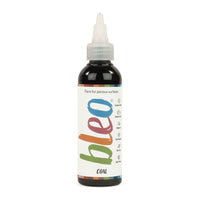 A bottle containing coloured gel paint, on a white background of bleo coal