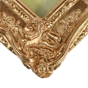
                      
                        Bronze metallic painted corner of an ornate frame on a white background
                      
                    