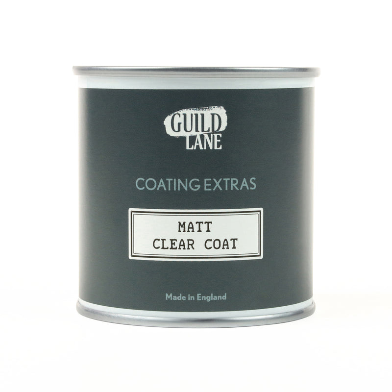 A jar of 'Guild Lane Coating Extras' Matt Clear Coat, indicating it's a matte finish coating.