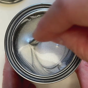 
                      
                        Load and play video in Gallery viewer, A hand stirs a bright, liquid silver metallic paint. The video captures the paint being swiped across a surface next to a silver-leafed ornate frame, showcasing a brilliant, mirror-like metallic finish.
                      
                    