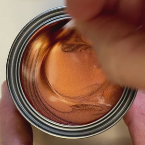 
                      
                        Load and play video in Gallery viewer, Vibrant, warm copper metallic paint being stirred with a wooden stick. The video shows the paint being applied in a thick, opaque stroke on a white background, highlighting its intense reddish-gold metallic lustre.
                      
                    