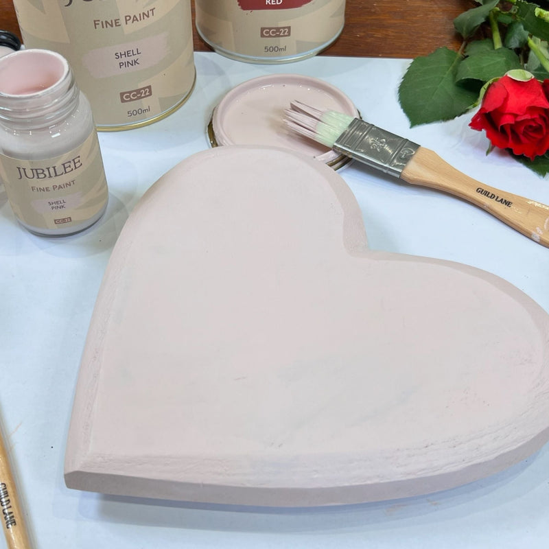 shell pink on wooden holder