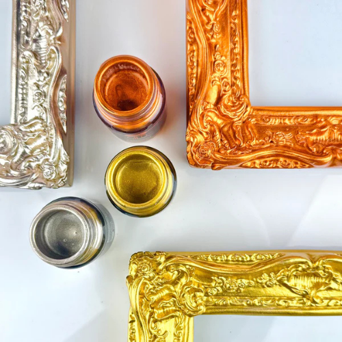 Decorative gold and silver frames on a white background