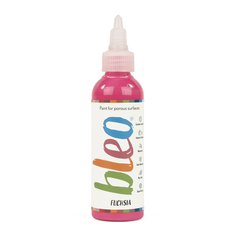 A bottle containing coloured gel paint, on a white background of bleo fuchsia