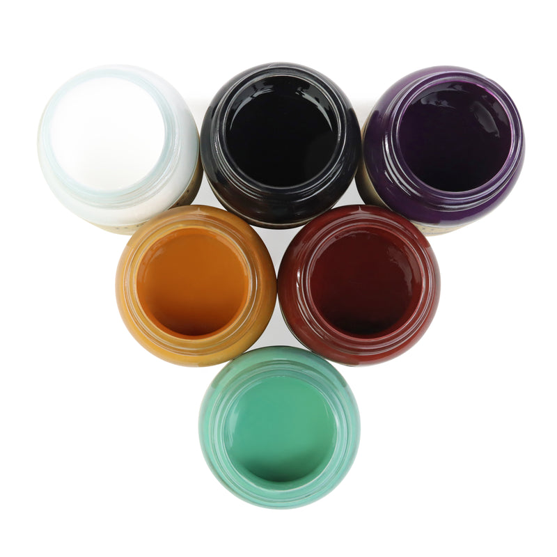 Jubilee set of coloured open jars of paints